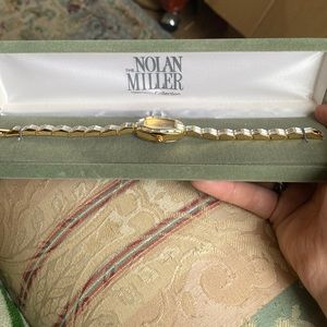 Brand new in the box Nolan Miller watch with certification card and warranty.